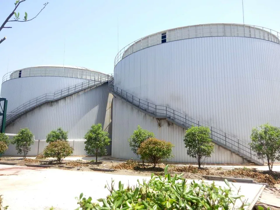 Anaerobic treatment tanks with external access stairs at the Baihehua wastewater-treatment site